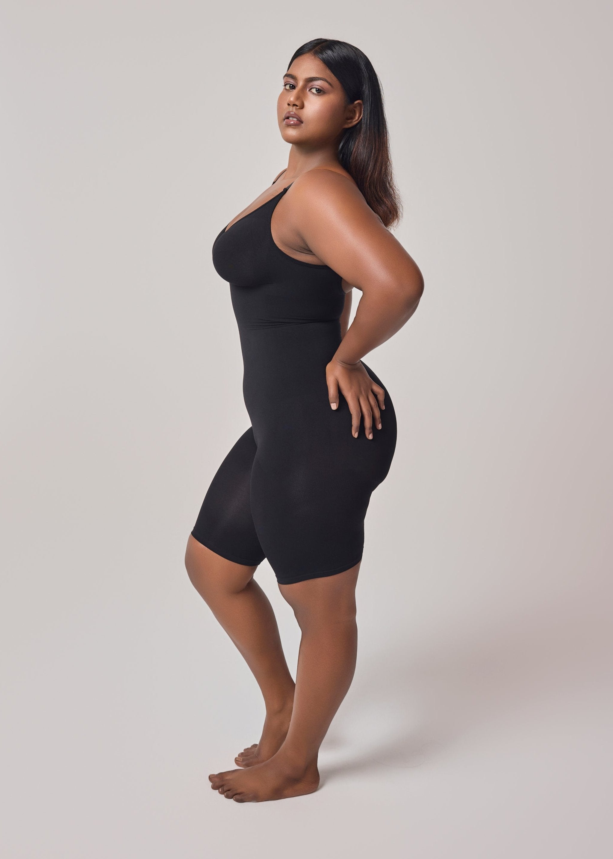 a women in intense mid thigh body shapewear