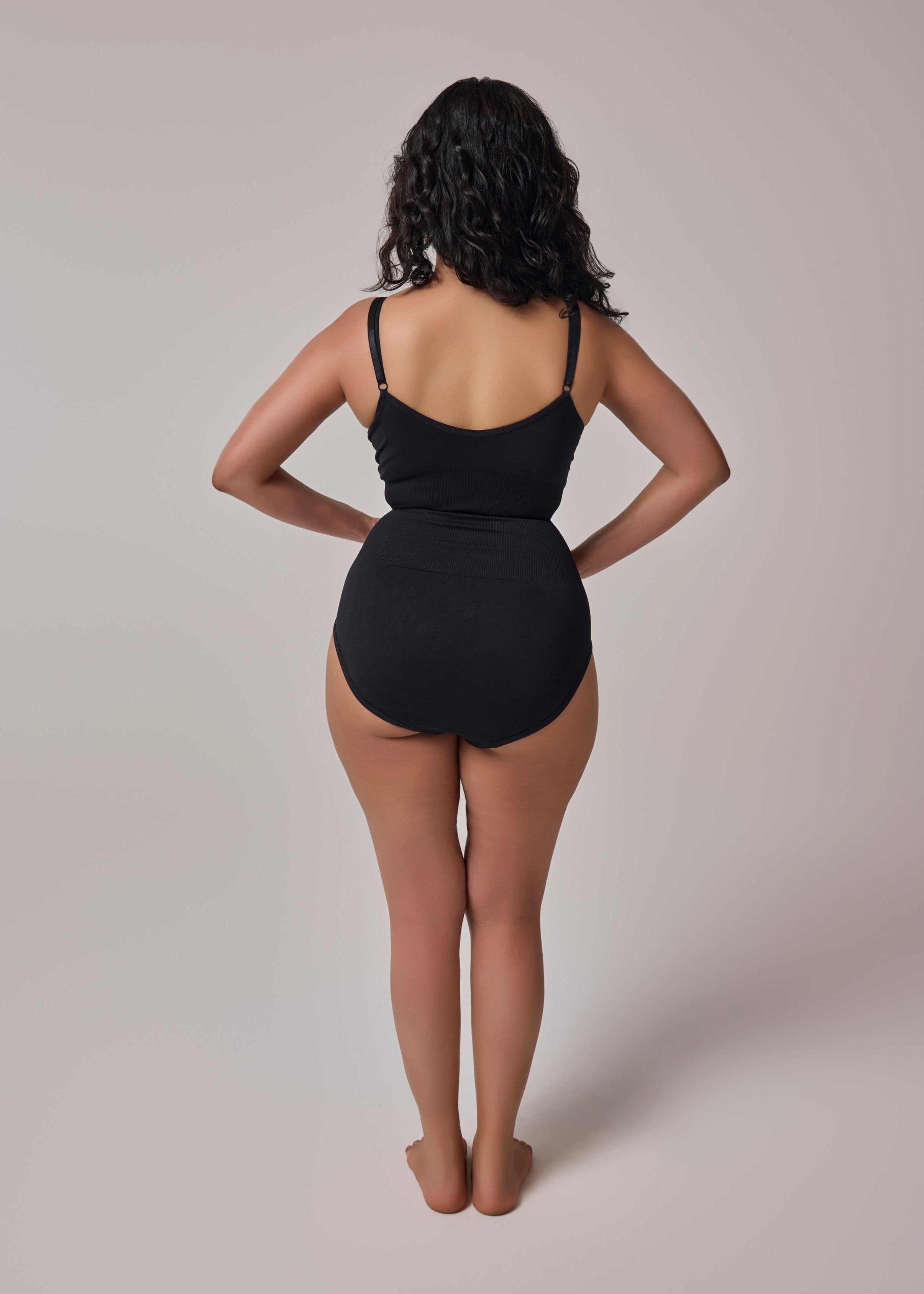 waist snatching bodysuit in black color back side view