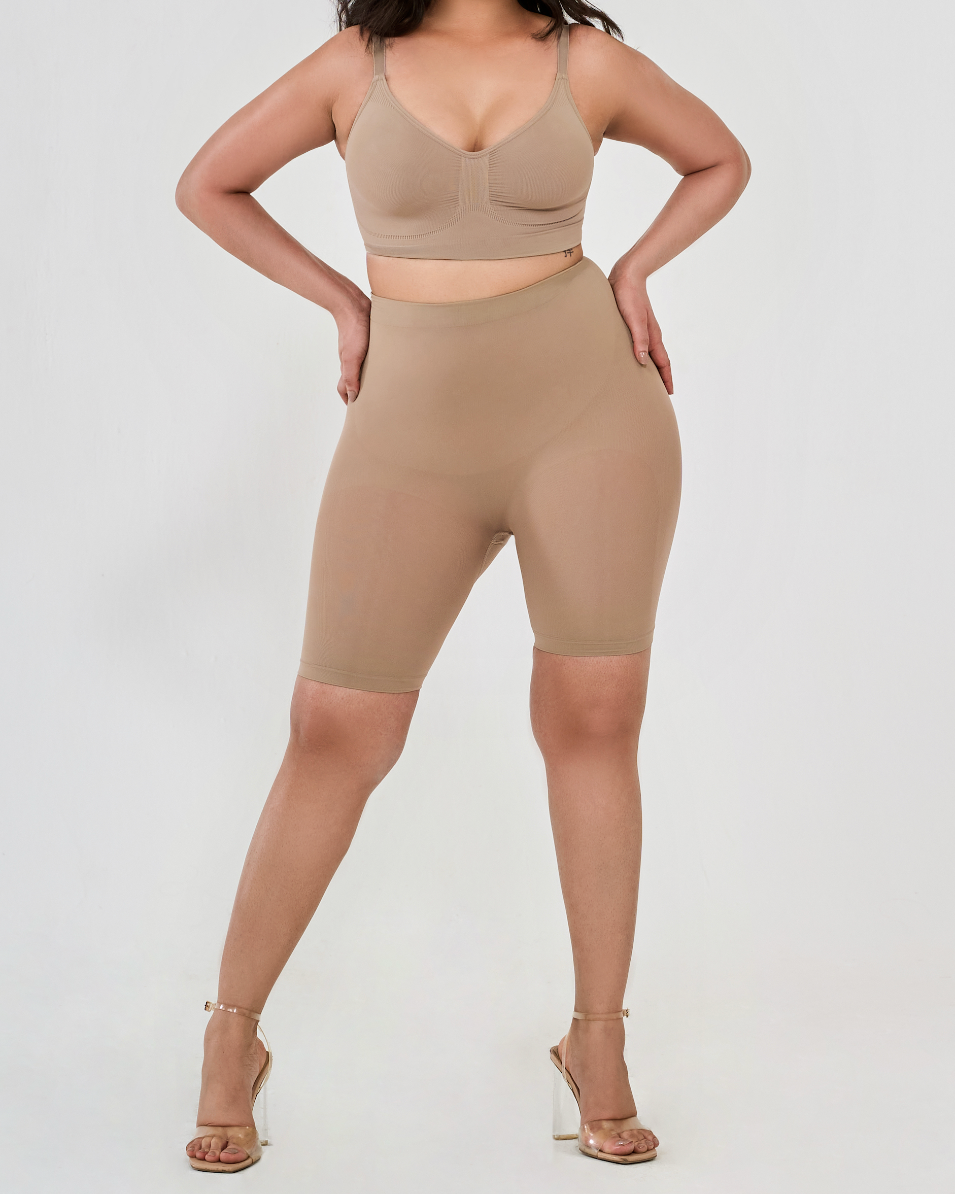 Front view of beige high waisted shaper shorts highlighting tummy control, thigh sculpting, and smooth design.
