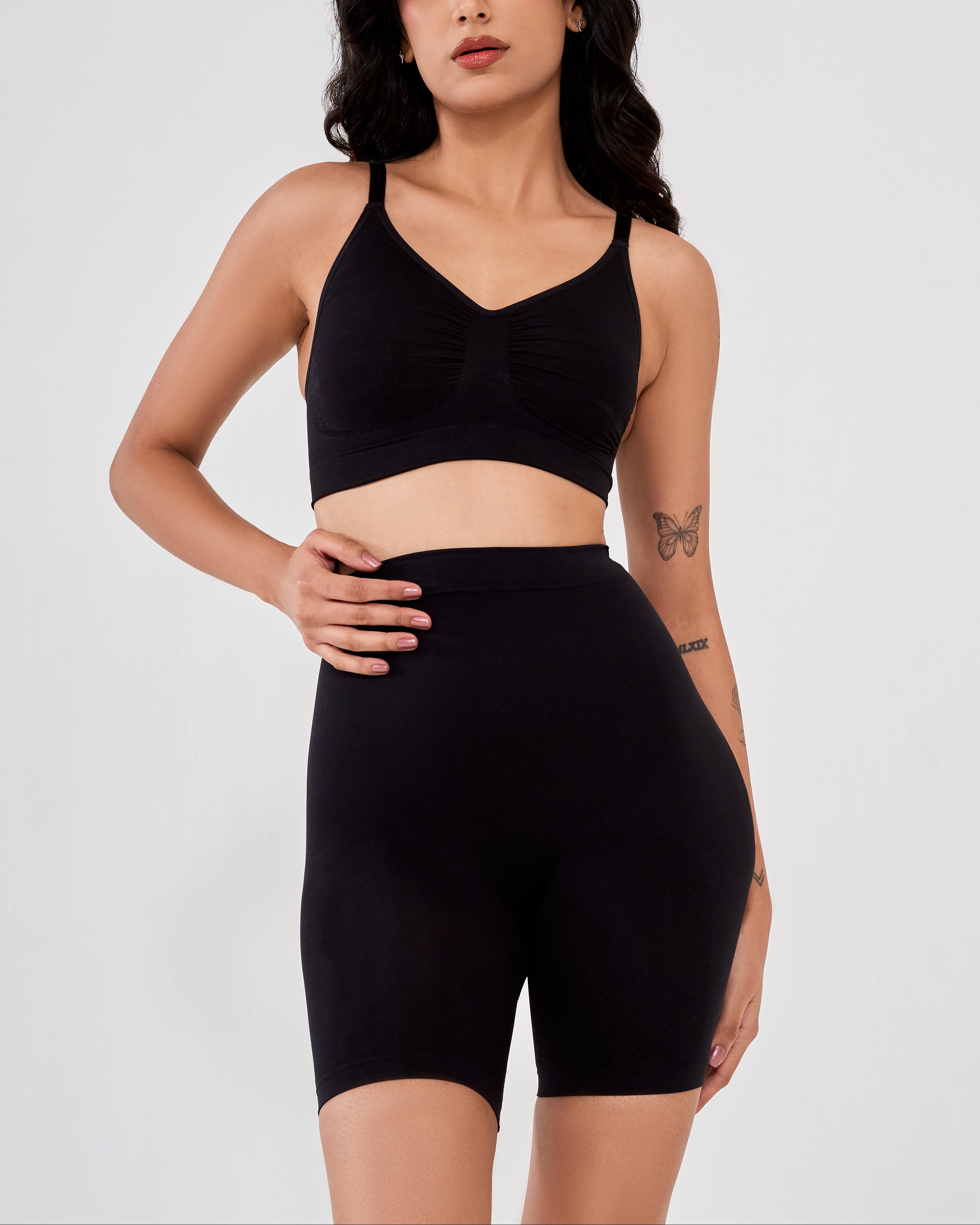 Close up of black high waisted shaper shorts showing seamless waistband and smooth compression